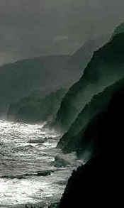 waves breaking on a dark shore