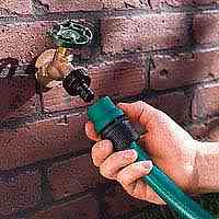 a hose being connected to a faucet