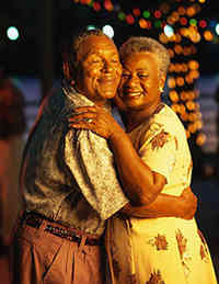 couple dancing, smiling with eyes closed