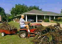 frame from video showing man driving tractor - he is the onedoing watchful waiting
